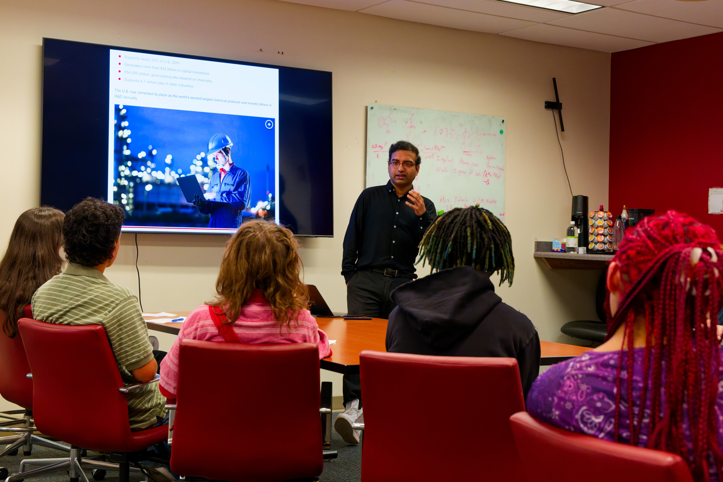 Students watching Dr. Ghosh